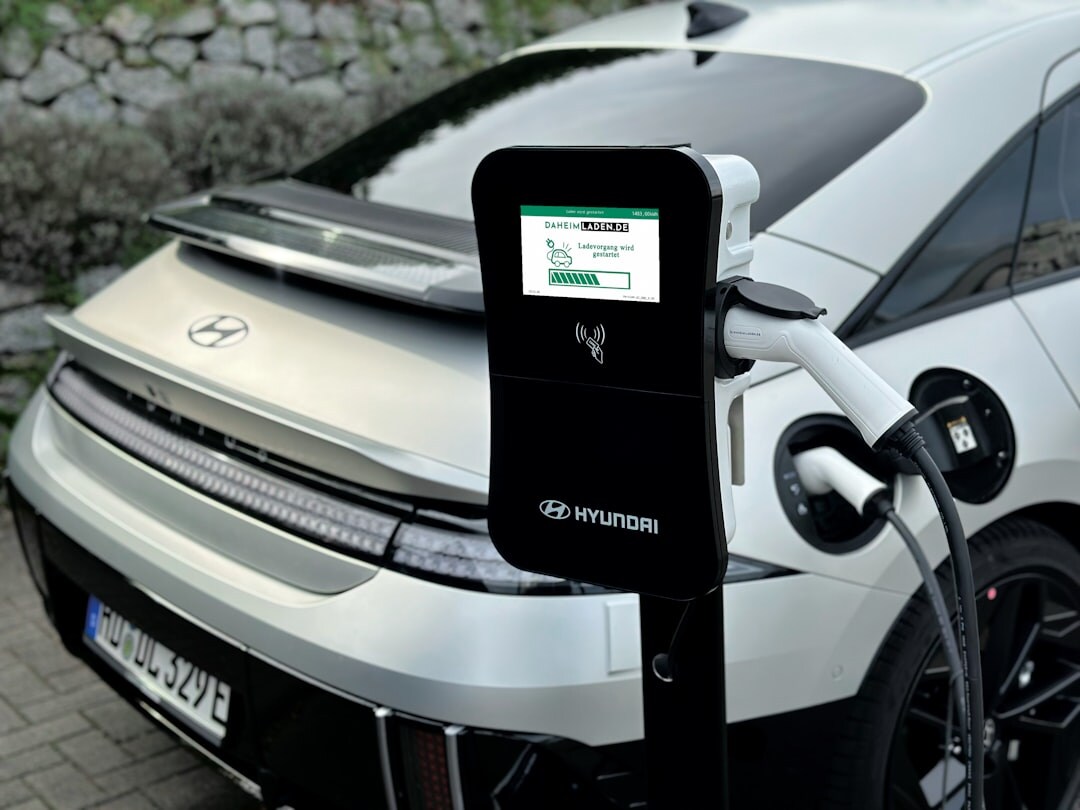 Modern electric supercar charging at a sleek charging station