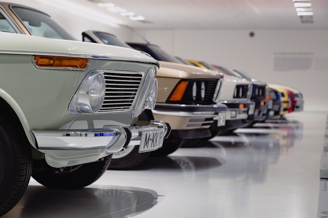 Private collector garage with multiple luxury cars parked in rows