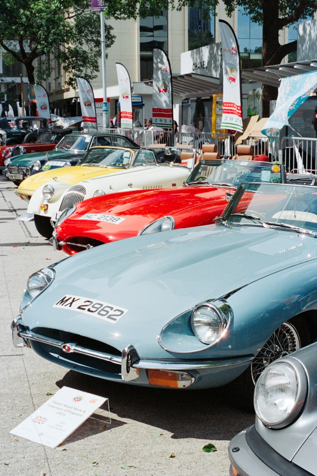 Vintage luxury car displayed at an elegant outdoor concours event