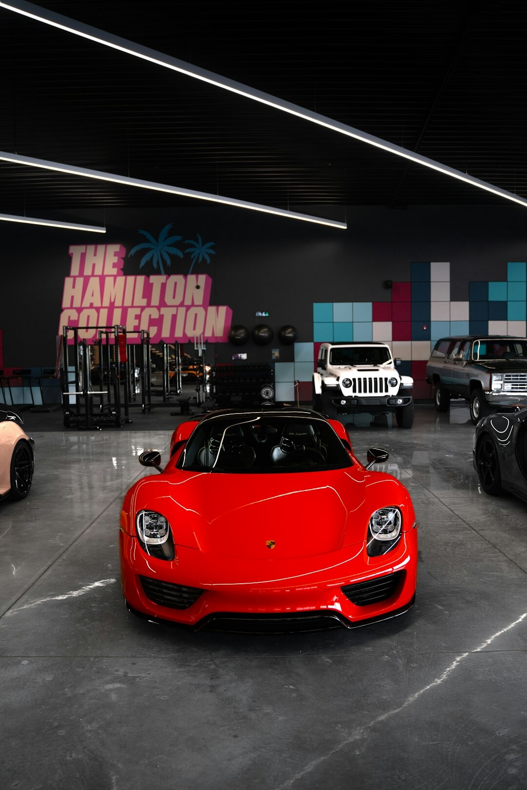 Luxury sports car inside a private showroom with dramatic lighting