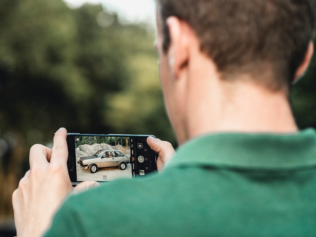 person taking car photos for sale